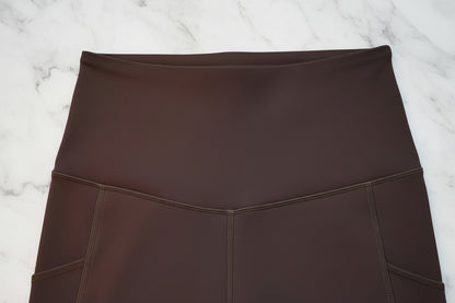 Espresso leggings on a light gray background