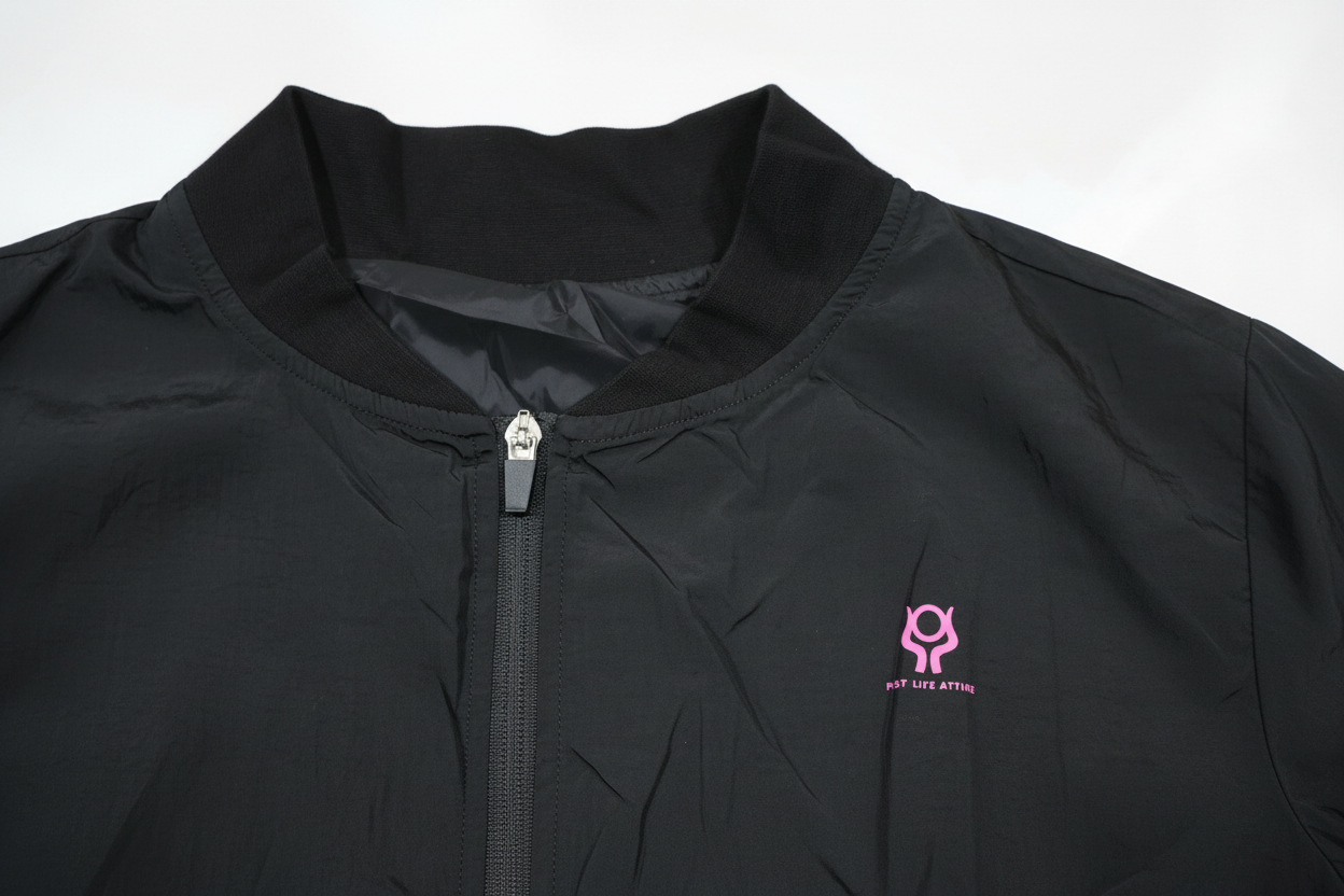 Black jacket with a pink logo on a white background